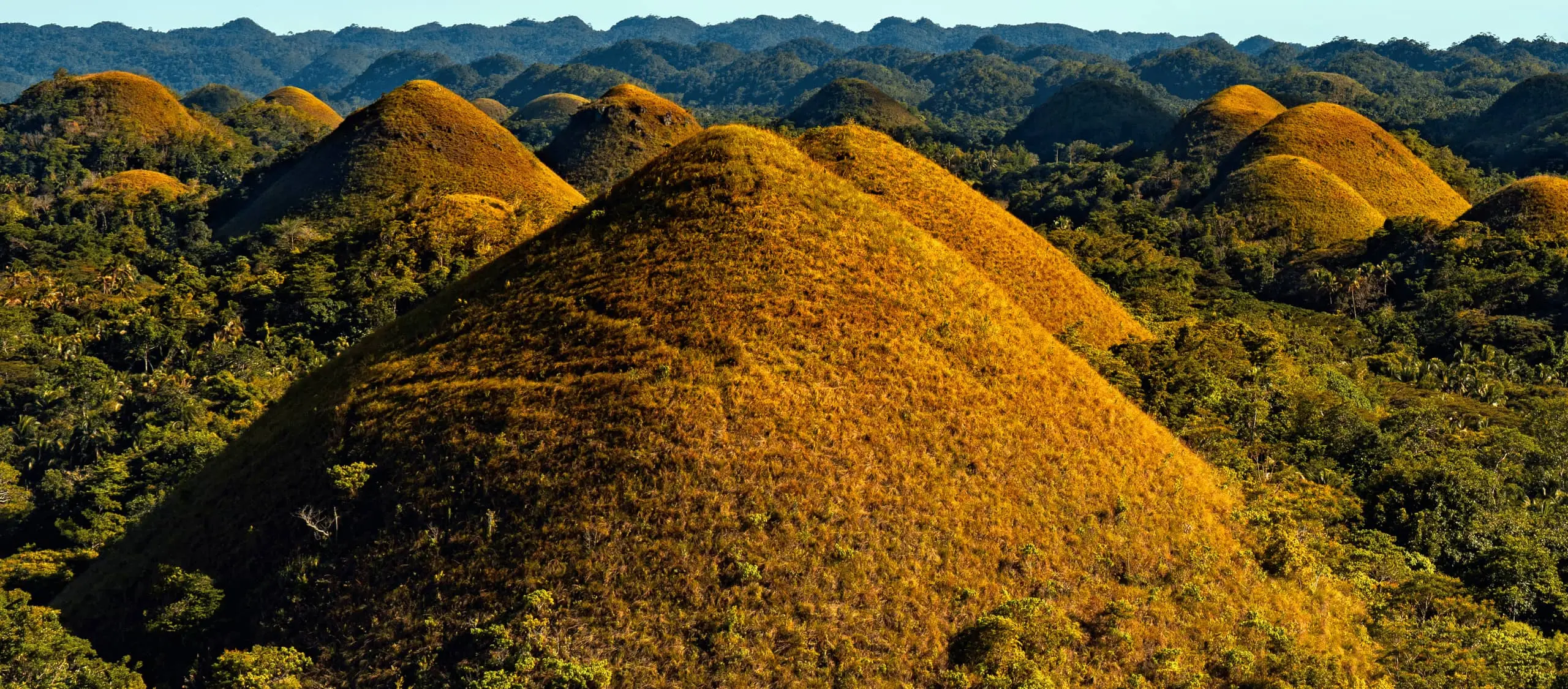 Car rental with driver Bohol — scenic drive to the Chocolate Hills in Carmen